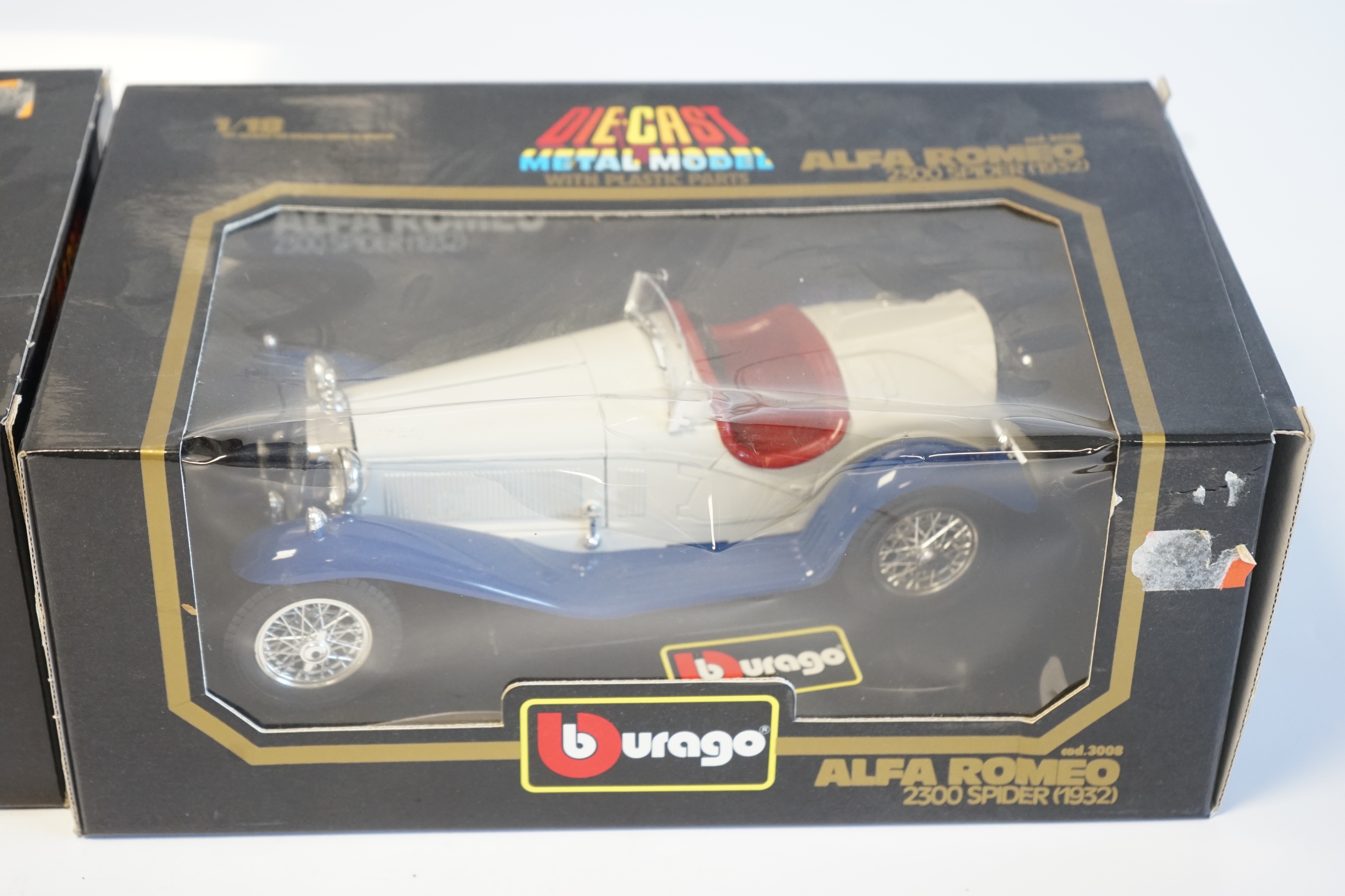 Six boxed Burago Diecast racing cars, five in 1/18 scale including; a Mercedes-Benz SSK, a Mercedes-Benz 300SL, a Jaguar SS100, a Lancia Aurelia B24 spider and an Alfa Romeo 2300 spider, together with a 1/24 scale Ford A